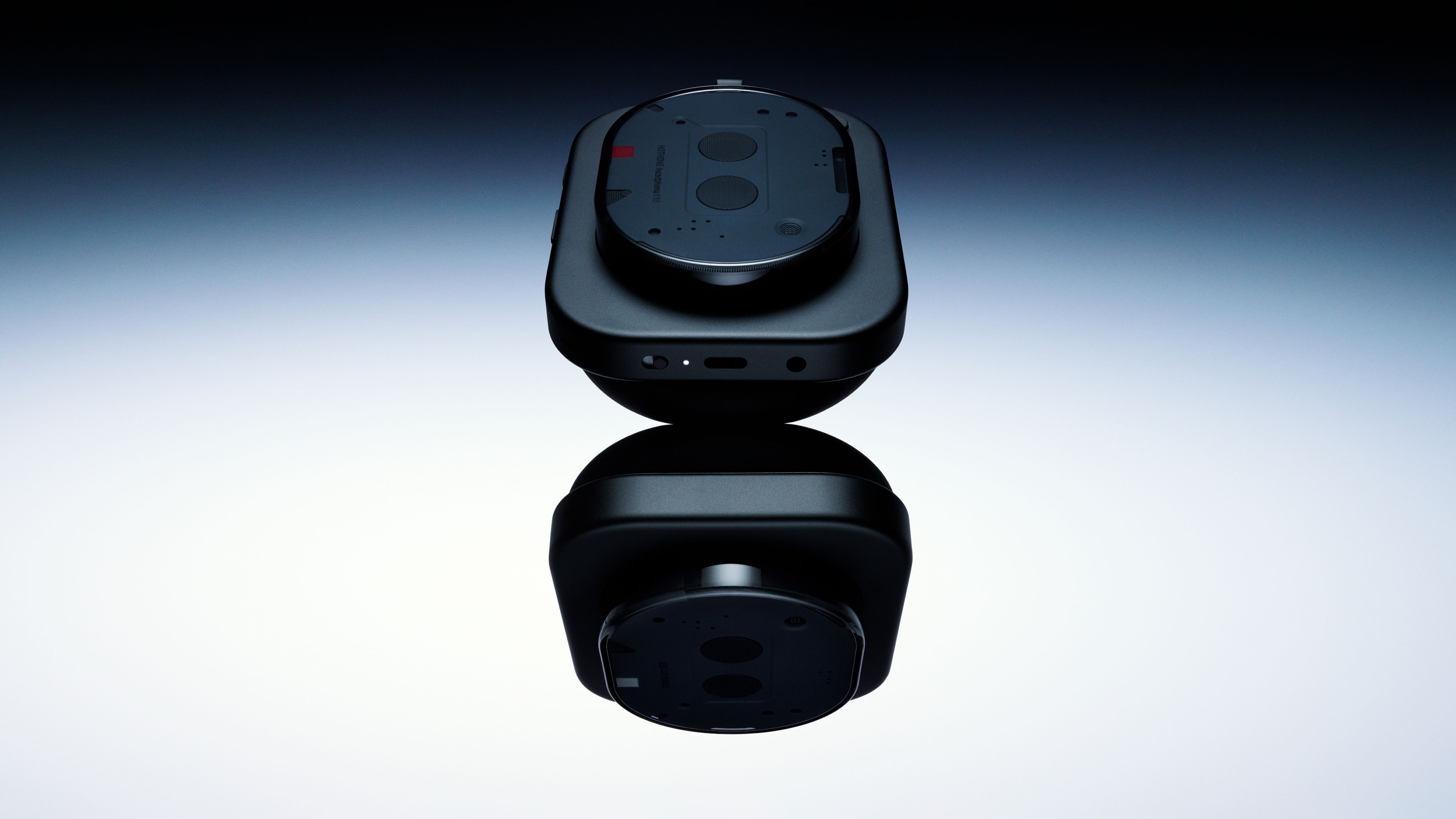 Close-up of Nothing Headphone (1) physical controls showing button layout and USB-C port on earcup